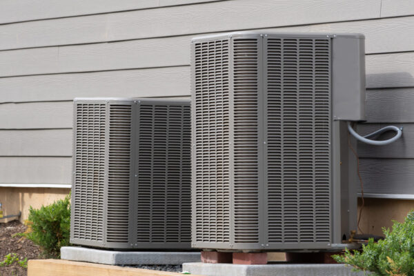 large air conditioning units positioned outside of the home